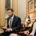 Photo by RDNE Stock project: https://www.pexels.com/photo/a-man-in-a-suit-looking-at-a-document-while-sitting-in-an-armchair-7841474/